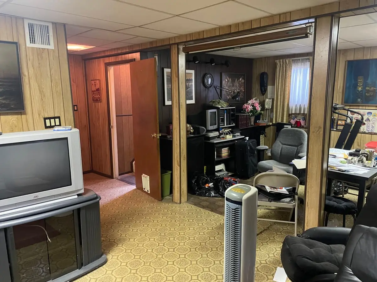 Selling estate property as an executor in Babylon: wood-paneled finished basement with a drop ceiling